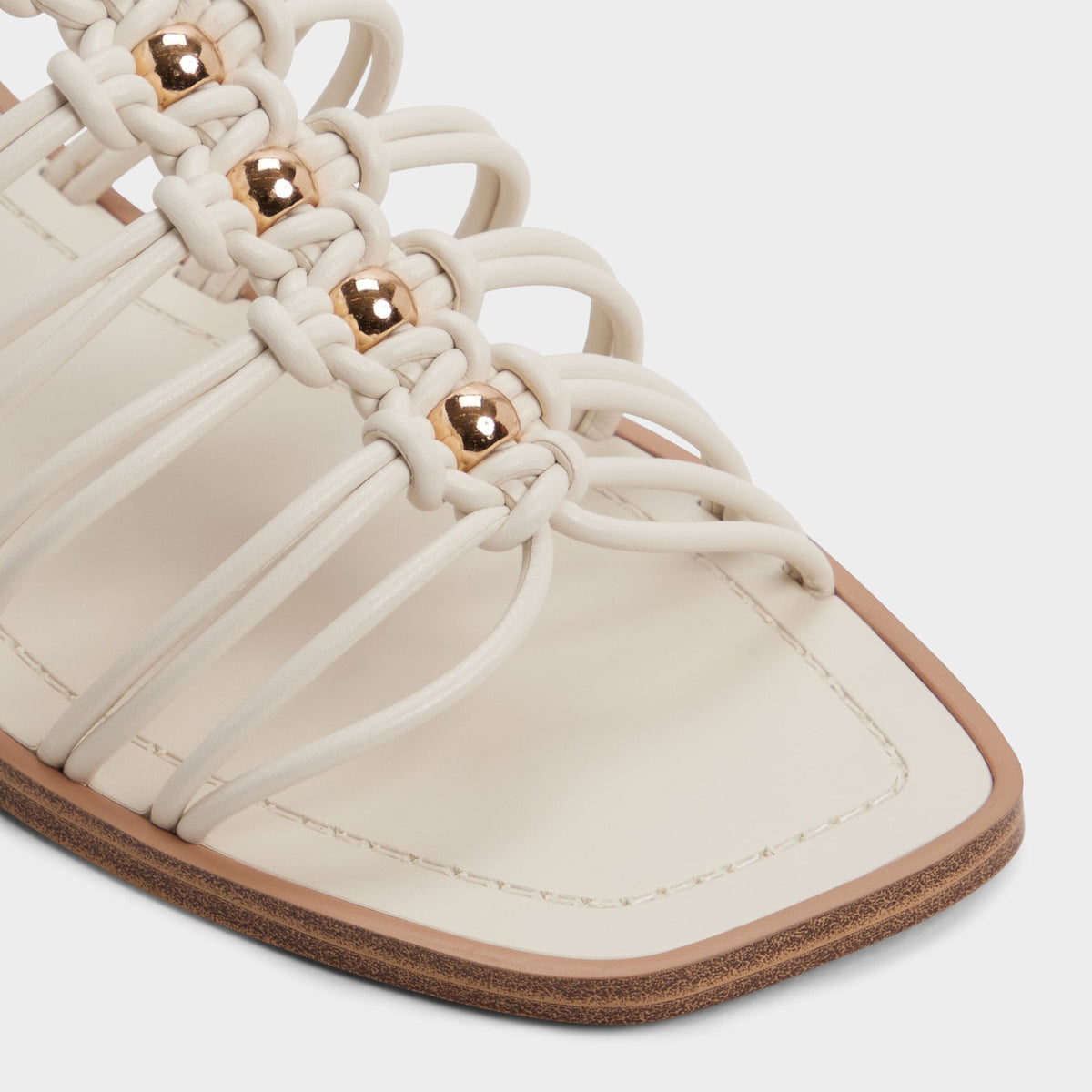 Unoma in White Bone - Strappy flat sandal | Aldo